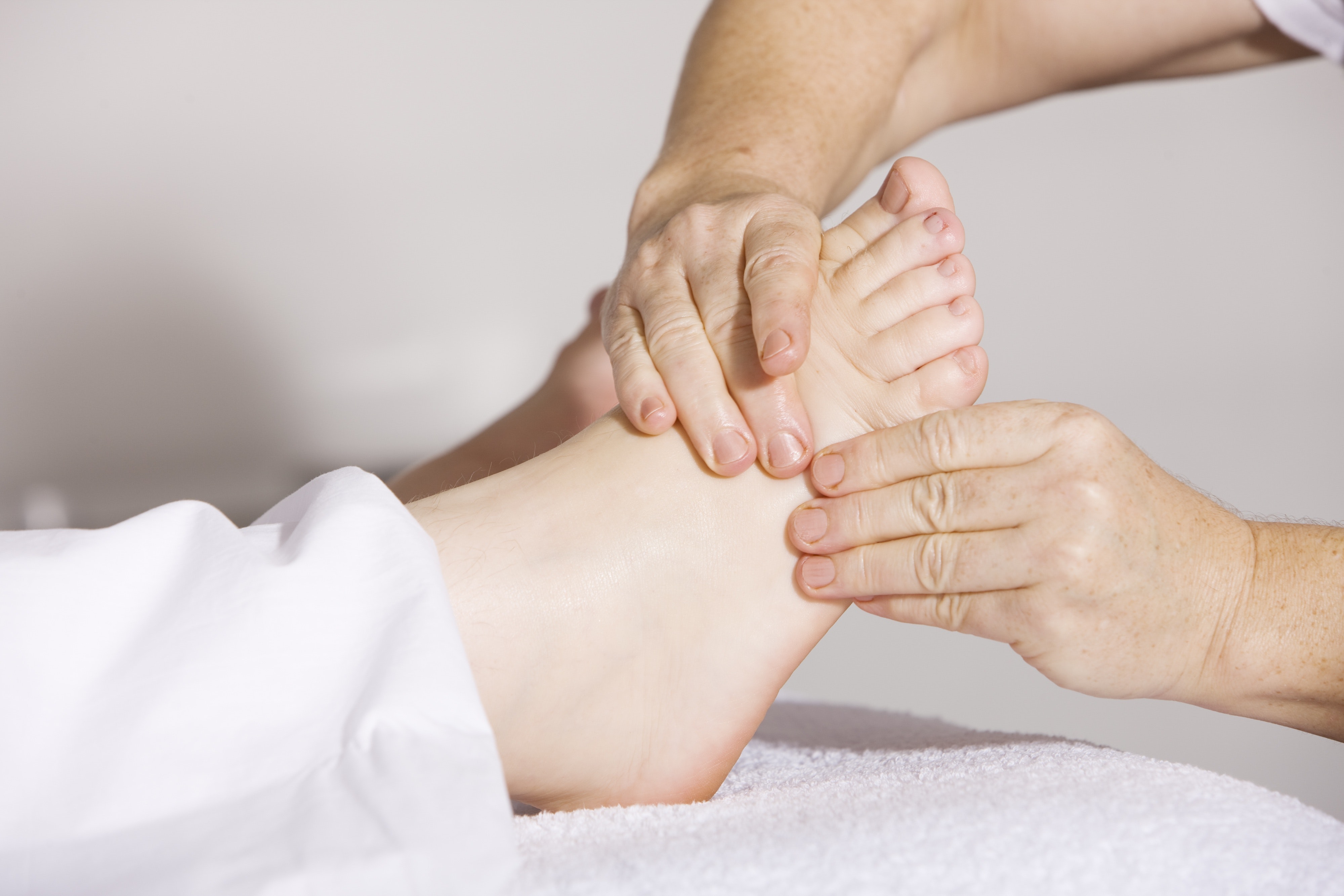 Person receiving a foot massage at Urban Oasis Day Spa