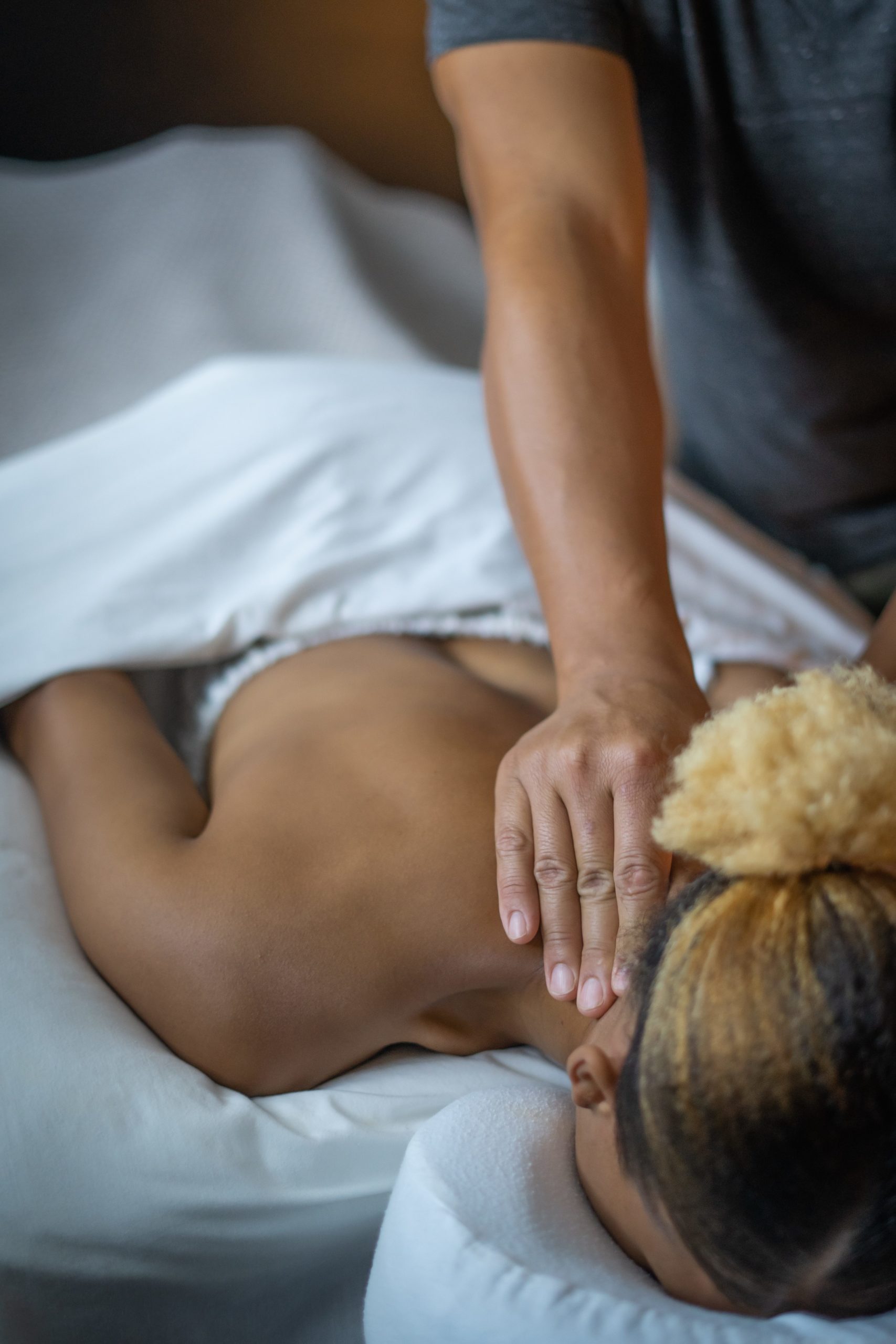 Woman receiving a back massage at Urban Oasis