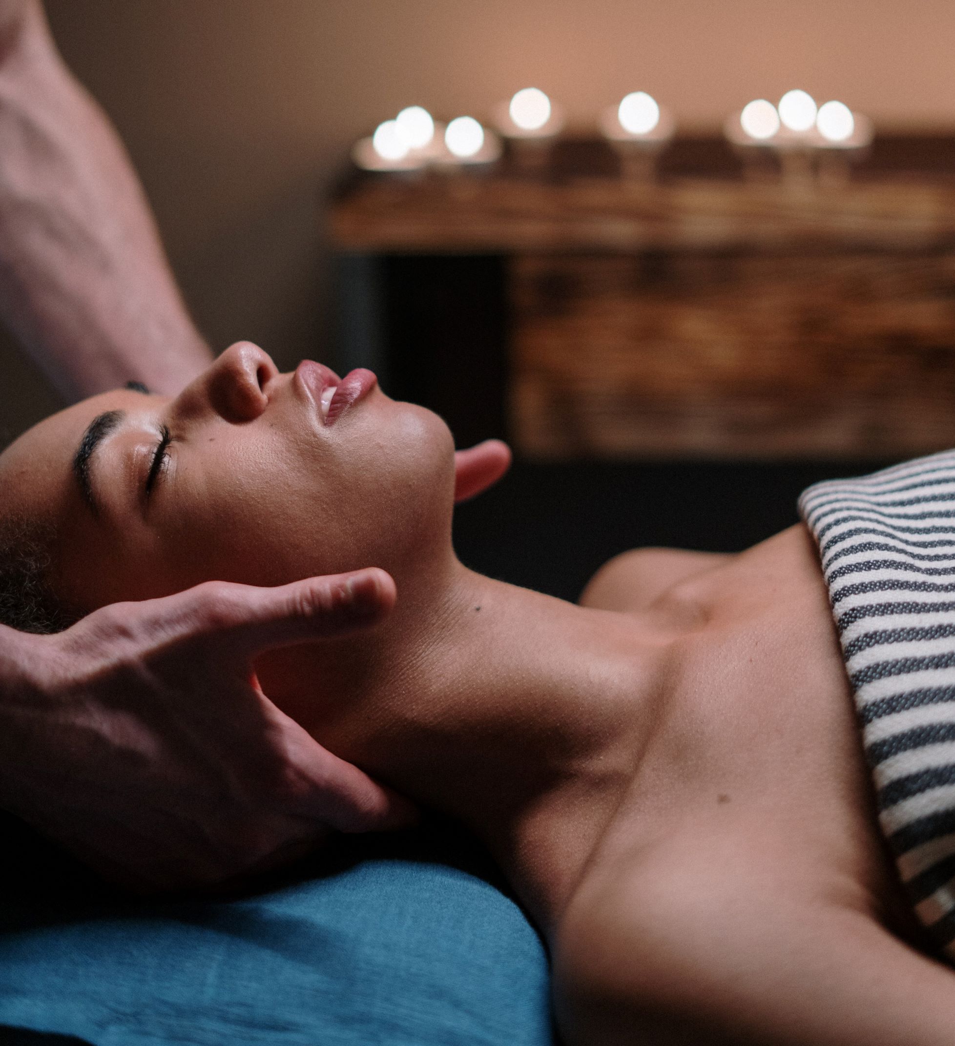 Woman receiving a neck massage at Urban Oasis day spa