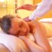 Woman having a relaxing massage at urban oasis day spa