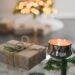 A gift box and candle. Wishing you happy holidays from Urban Oasis Day Spa!