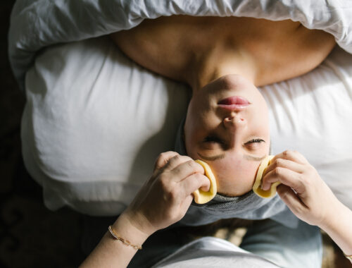 Woman receiving a relaxing facial treatment at Urban Oasis Nashville spa