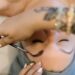 Woman receiving brow tint, brow lamination and lash lift combo treatment at Urban Oasis Nashville spa