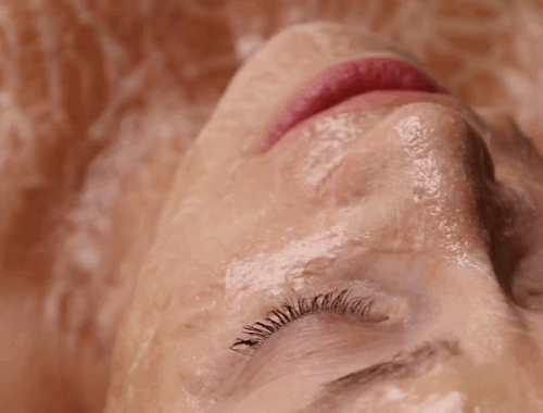 Woman receiving the Zombie Facial with peptide firming mask applied at Urban Oasis Nashville