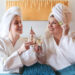 Two women enjoying a fun spa day together at Urban Oasis Nashville, relaxing and laughing during their Nashville spa experience.