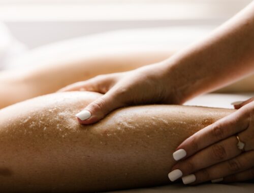 Woman receiving a therapeutic Oasis massage and body treatment at Urban Oasis Nashville, designed to support muscle relief, relaxation, and overall wellness