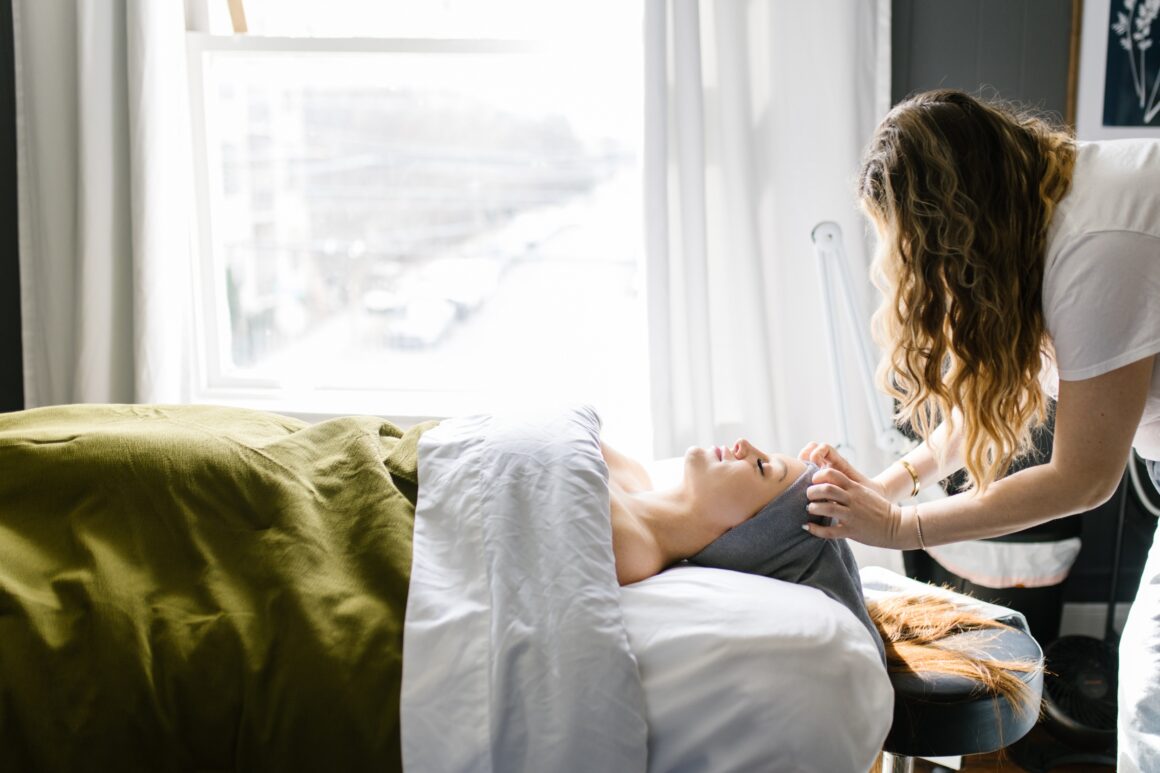 Professional facial treatment being performed by an esthetician at Urban Oasis Nashville day spa.