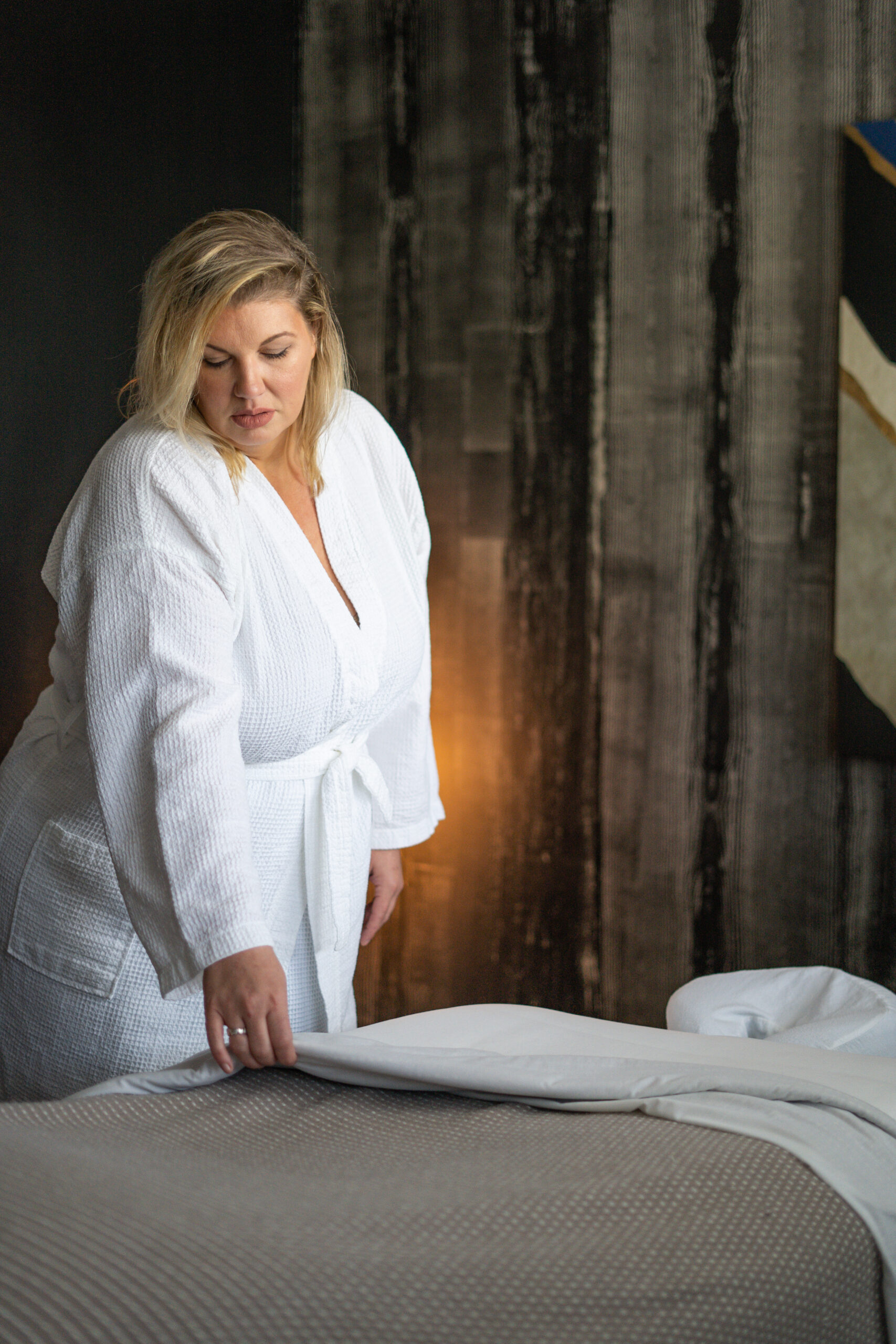 Woman in spa robe preparing for a relaxing massage at Urban Oasis Nashville day spa