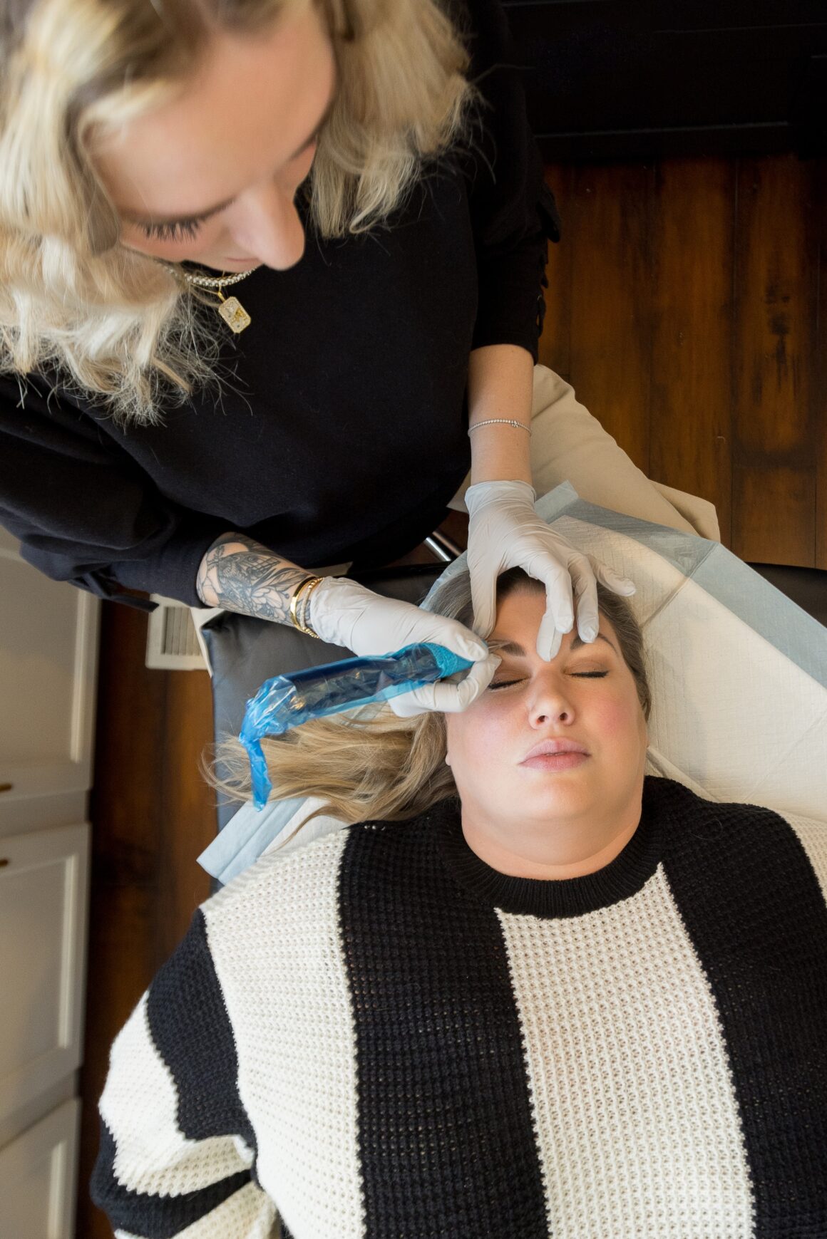 Licensed permanent makeup artist performing a customized nano brow procedure during a professional permanent makeup appointment at Urban Oasis Nashville.