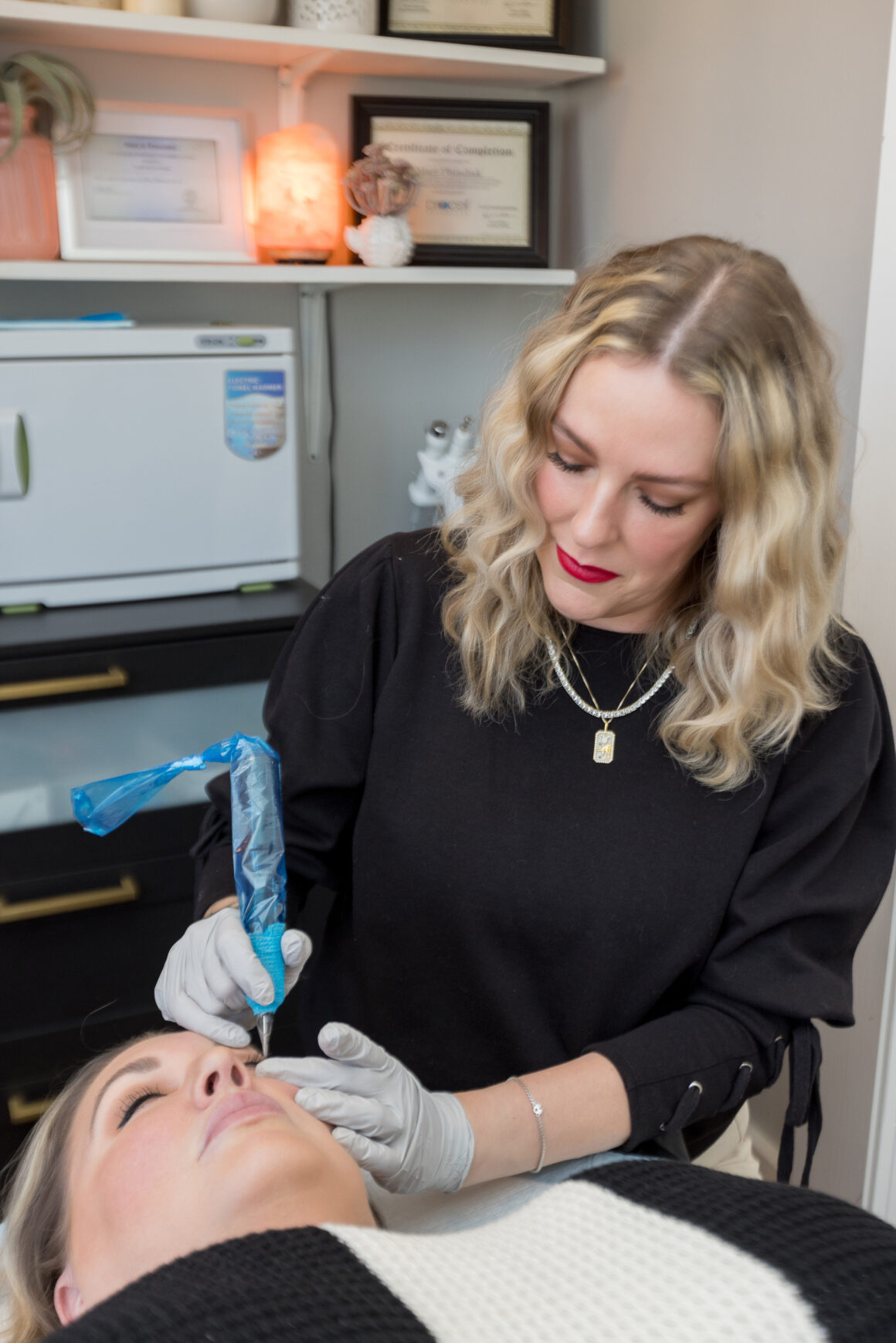 Licensed permanent makeup artist performing a customized nano brow procedure using modern PMU techniques at Urban Oasis Nashville.