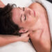 Massage therapist working on neck and shoulder tension at Urban Oasis Nashville